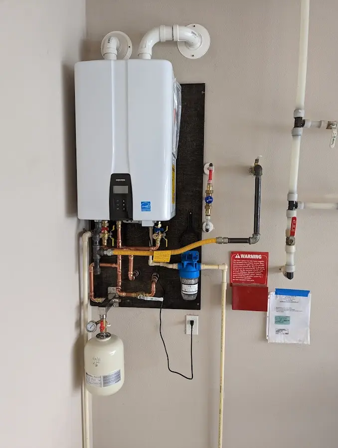 Professional plumber installing copper piping in a Willcox home